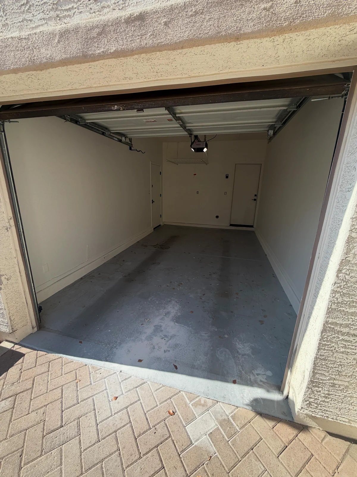 Garage concrete floor before coating, viewed from the driveway